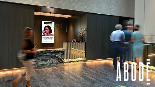 An Abode Residential Media screen in the reception of a residential development