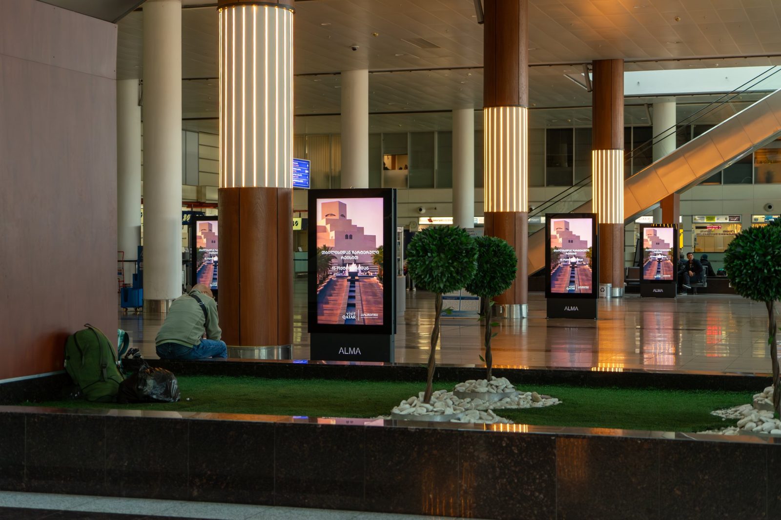 ALMA digital totems in the arrivals hall at Tbilisi airport