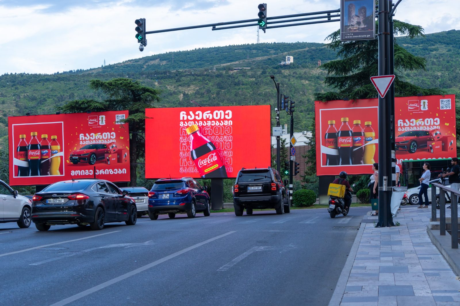 Three ALMA digital billboards running a synchronised campaign across a Tbilisi junction