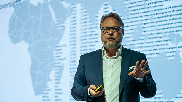 Dr Kai-Marcus Th�sler speaking on stage at the WOO London Congress 2026